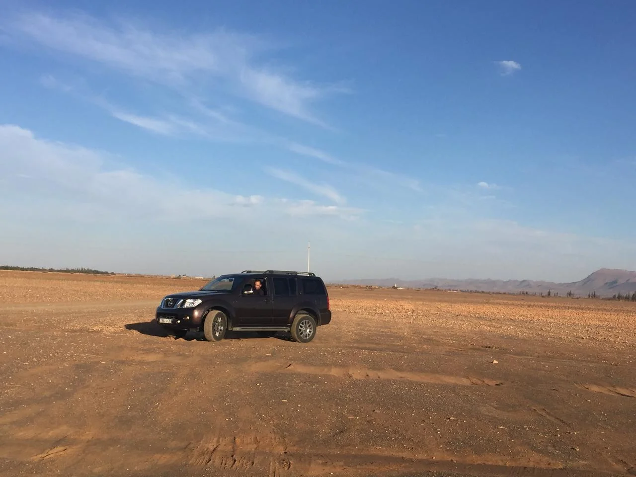 4x4 vehicle crossing the Sahara desert in Morocco