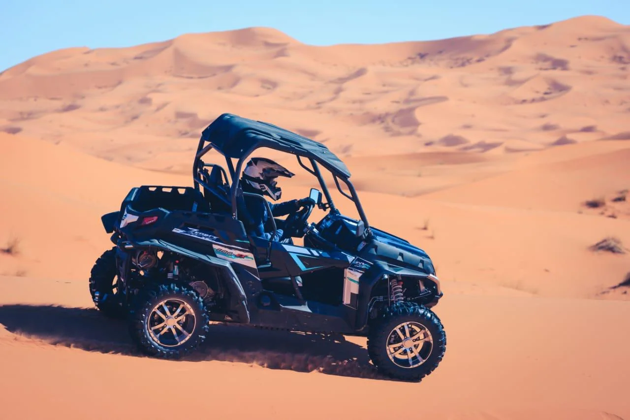 Buggy driving through the Sahara desert in Morocco